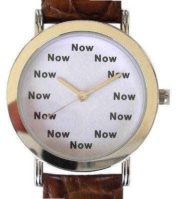 "Now" Is the Time That Is Shown Each Hour on the White Dial of the Polished Chrome Tone Round with a Brown Croc Design Leather Strap